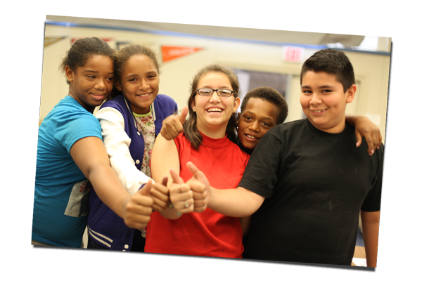 Students giving a group thumbs up